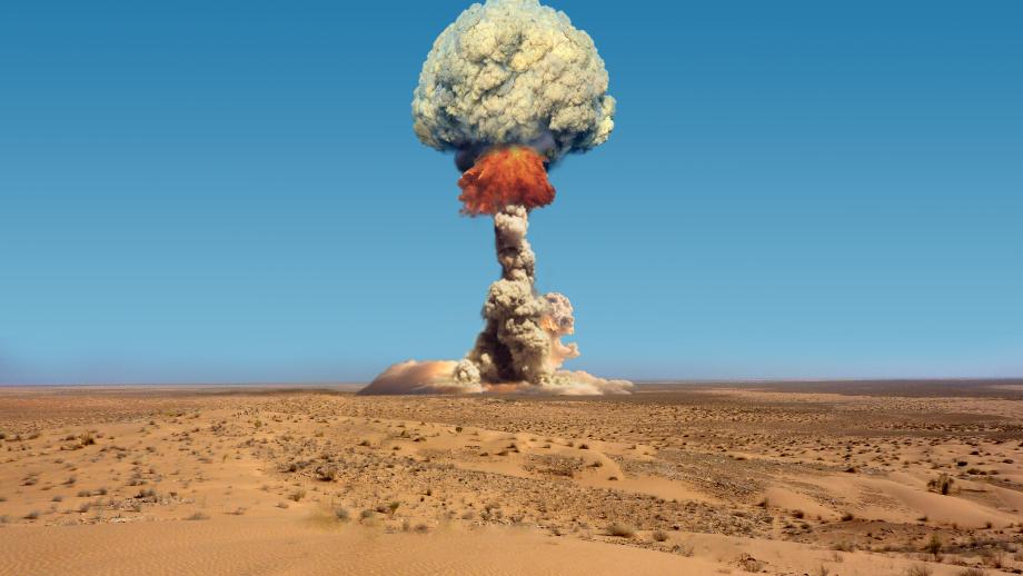 A shot of a mushroom cloud in wake of a nuclear test.